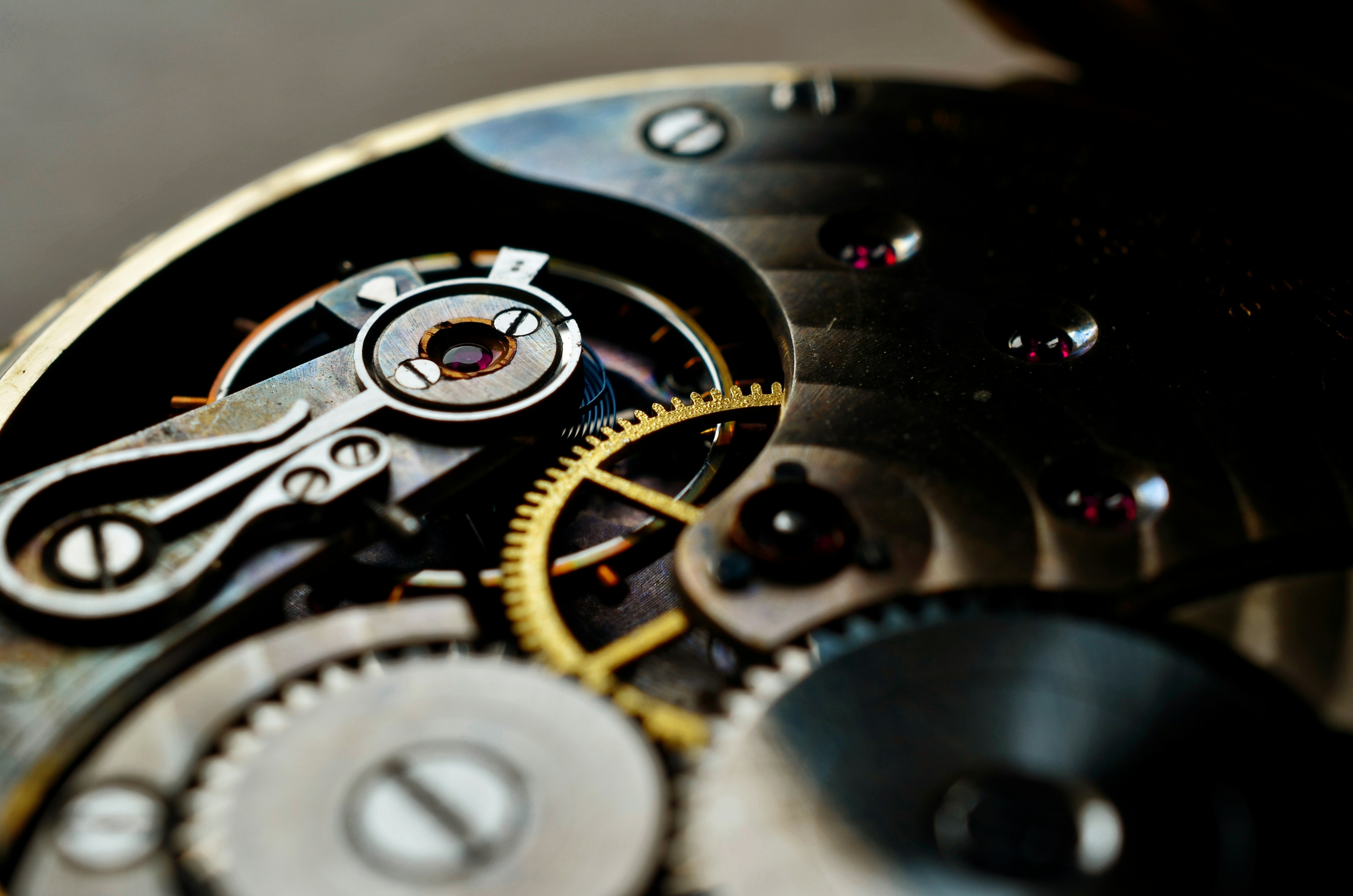 A close up image of a clockwork with cogwheels